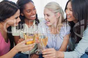 Friends toasting with white wine