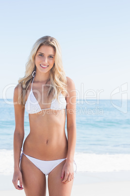 Beautiful blonde smiling in white bikini