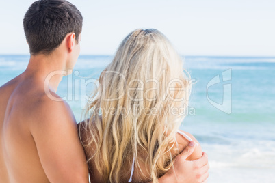 Rear view of couple looking out to sea