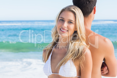 Pretty blonde smiling and leaning against her boyfriend Pretty blonde smiling and leaning against her boyfriend