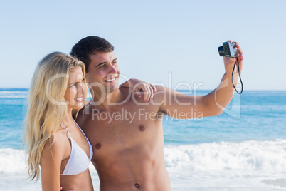 Man taking self portrait of him and girlfriend