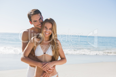 Athletic couple smiling at camera