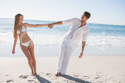 Couple holding hands and leaning to either side