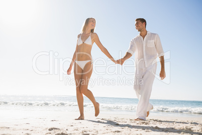 Pretty blonde walking away from man holding her hand