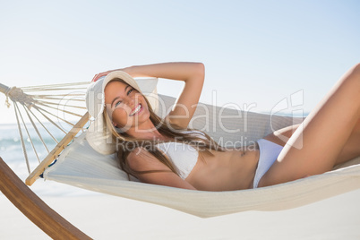 Cheerful blonde relaxing on hammock