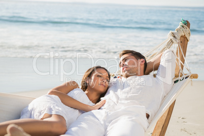 Peaceful couple relaxing on hammock