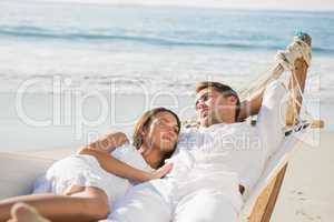 Peaceful couple relaxing on hammock