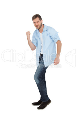 Handsome man posing with clenched fist