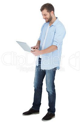 Casual man using his laptop