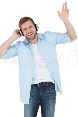 Cool trendy model listening to music and smiling