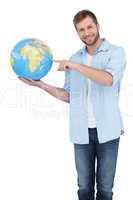 Charming model holding a globe