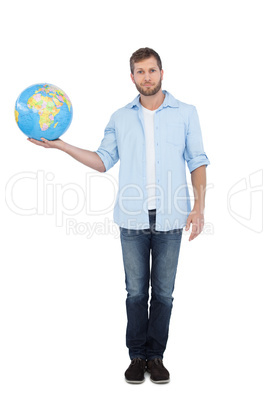 Charming young model holding a globe Charming young model holding a globe