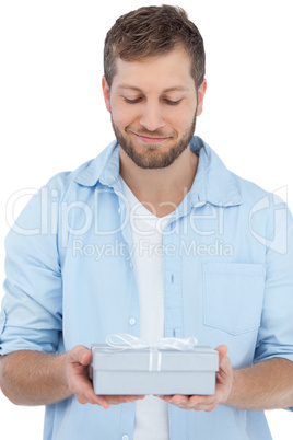 Handsome man holding a present