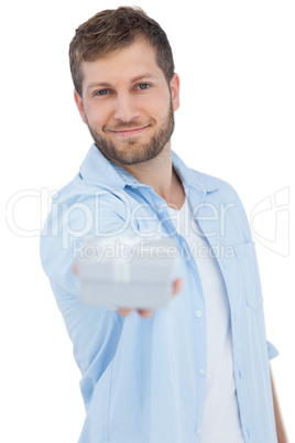 Portrait of young model offering gift