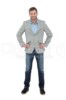 Stylish man smiling with hands on hips