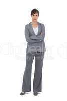 Young businesswoman with arms crossed