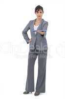 Attractive businesswoman holding tablet pc