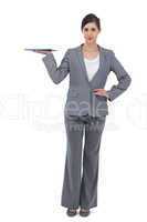 Smiling businesswoman holding tablet pc