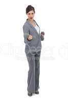 Businesswoman holding dumbbells
