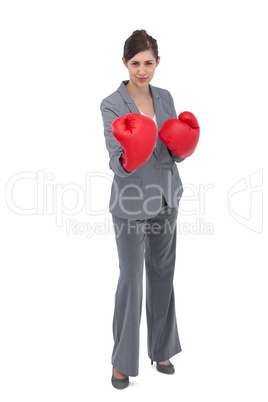 Competitive woman with boxing gloves