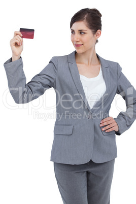 Confident businesswoman with credit card
