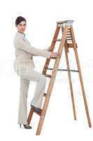 Businesswoman climbing career ladder