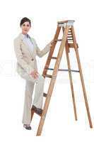Businesswoman climbing the career ladder