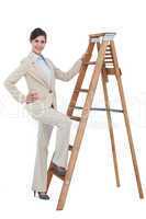 Cheerful businesswoman climbing the career ladder