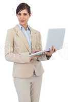 Young businesswoman holding laptop