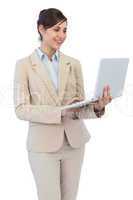 Smiling young businesswoman with laptop