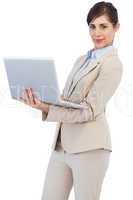 Confident young businesswoman with laptop