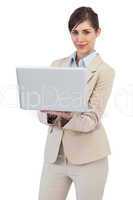Confident businesswoman with laptop