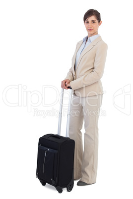 Businesswoman posing with suitcase