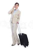Businesswoman posing with suitcase and phone