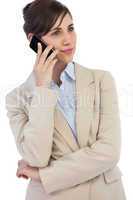 Pensive businesswoman on the phone