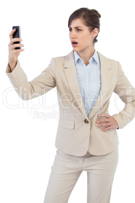 Angry businesswoman on the phone