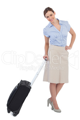 Cheerful classy businesswoman carrying suitcase