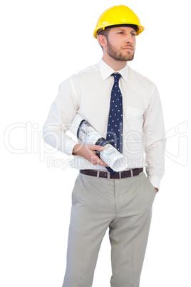 Young architect posing with hard hat and plan