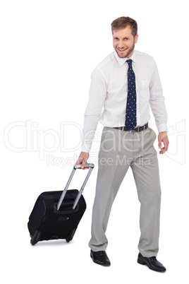 Cheerful businessman with suitcase