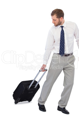 Annoyed businessman with suitcase