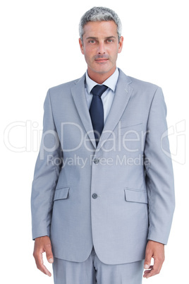 Serious confident businessman posing