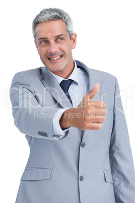 Cheerful businessman reaching for handshake