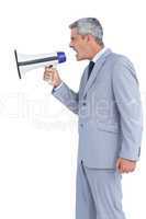 Businessman shouting in loudspeaker