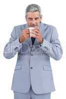 Businessman drinking cup of coffee