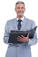 Cheerful businessman holding clipboard