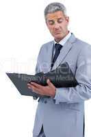 Disappointed businessman holding clipboard