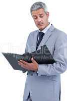 Attentive businessman holding clipboard