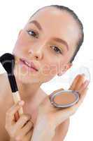 Seductive model holding make up