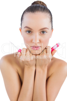 Model holding lip gloss