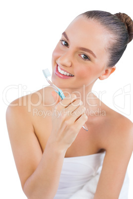 Cheerful young woman with toothbrush